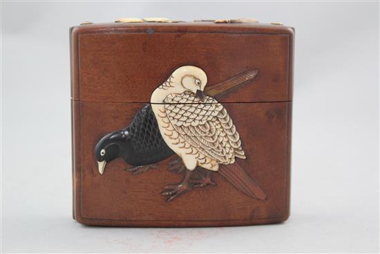 A Japanese cherrywood, ivory, horn, mother of pearl and wood inlaid single case inro, 19th century, 9cm.